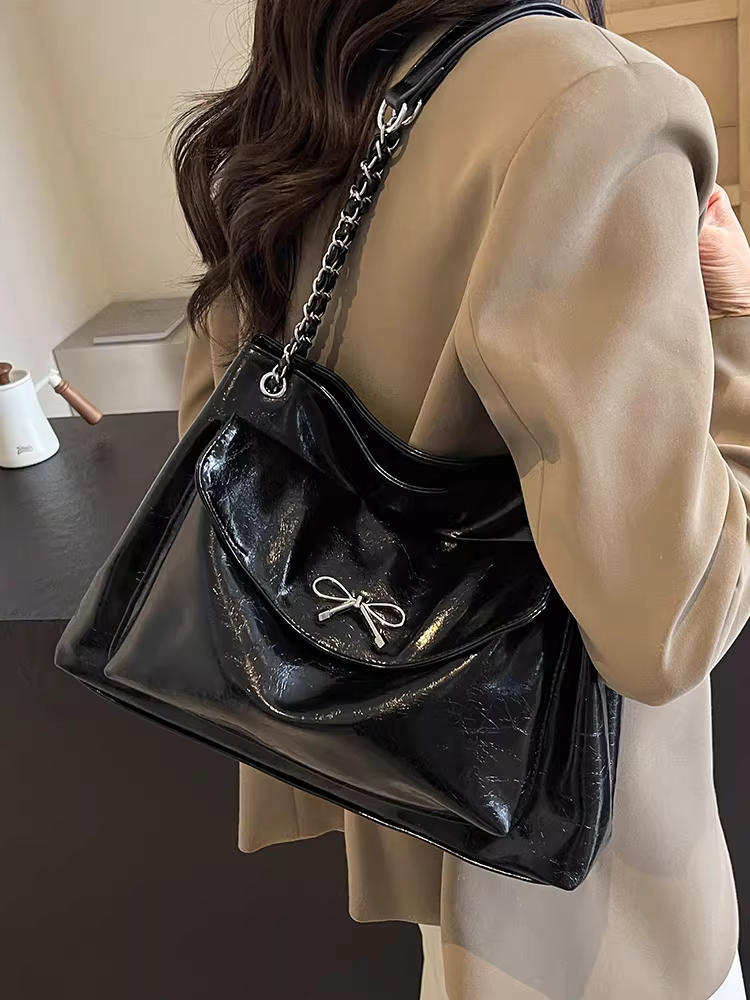 Túi xách nữ dung tích lớn 2025 kiểu dáng mới màu đen dây xích cao cấp túi đeo vai đi làm túi tote có họa tiết