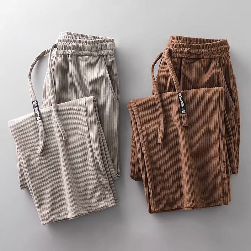 Quần thể thao nam chất liệu corduroy dày dặn, kiểu mới xuân 2025, phong cách retro Mỹ, dáng rộng, chất liệu mềm mại, quần thể thao ống rộng, quần thường ngày.