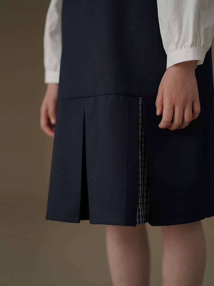 Quần áo trẻ em mùa xuân hè váy vest màu xanh hải quân đơn giản cao cấp phong cách học sinh váy mùa xuân mới cho bé gái
