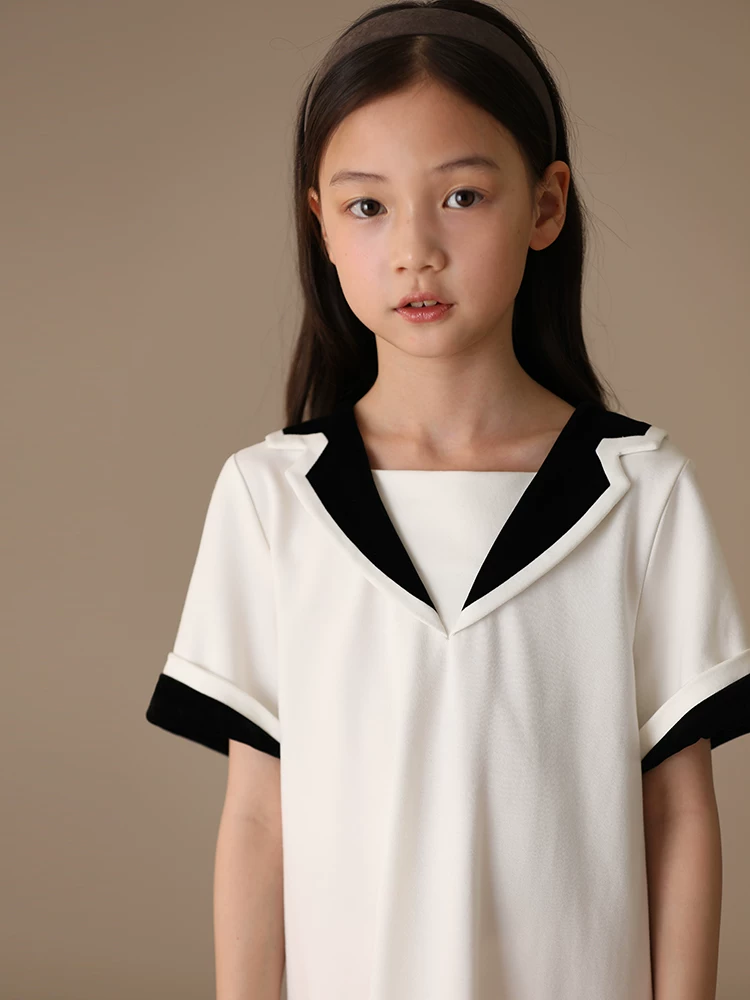 Váy polo tương phản màu đen trắng mùa xuân hè Váy ngắn tay có cổ nhung vàng dành cho trẻ em dành cho bé gái