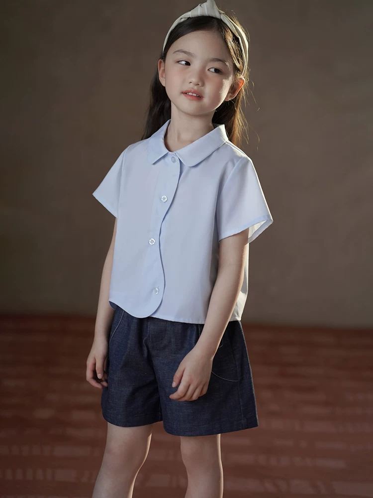 Quần áo trẻ em Hazi Quần áo mùa hè 25 kiểu mới Áo cotton thân thiện với da màu xanh Áo sơ mi ngắn tay cho bé gái Thiết kế đơn giản