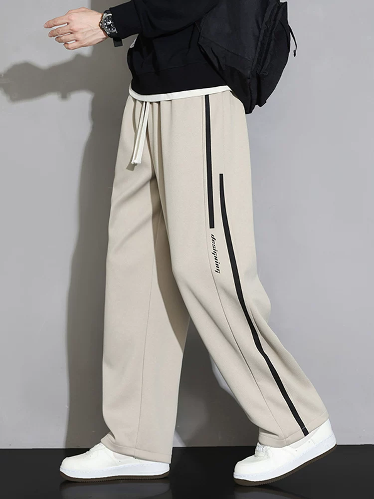Quần dài thể thao sọc thẳng kiểu Mỹ của Jeanswest dành cho nam, mùa xuân thu, cảm giác cao cấp, dáng rộng, quần dài thể thao đa năng.