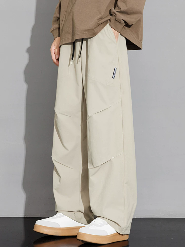 Quần dài ống rộng phong cách Mỹ của Jeanswest dành cho nam, quần dài ống rộng đa năng, thương hiệu thời trang xuân thu cao cấp.