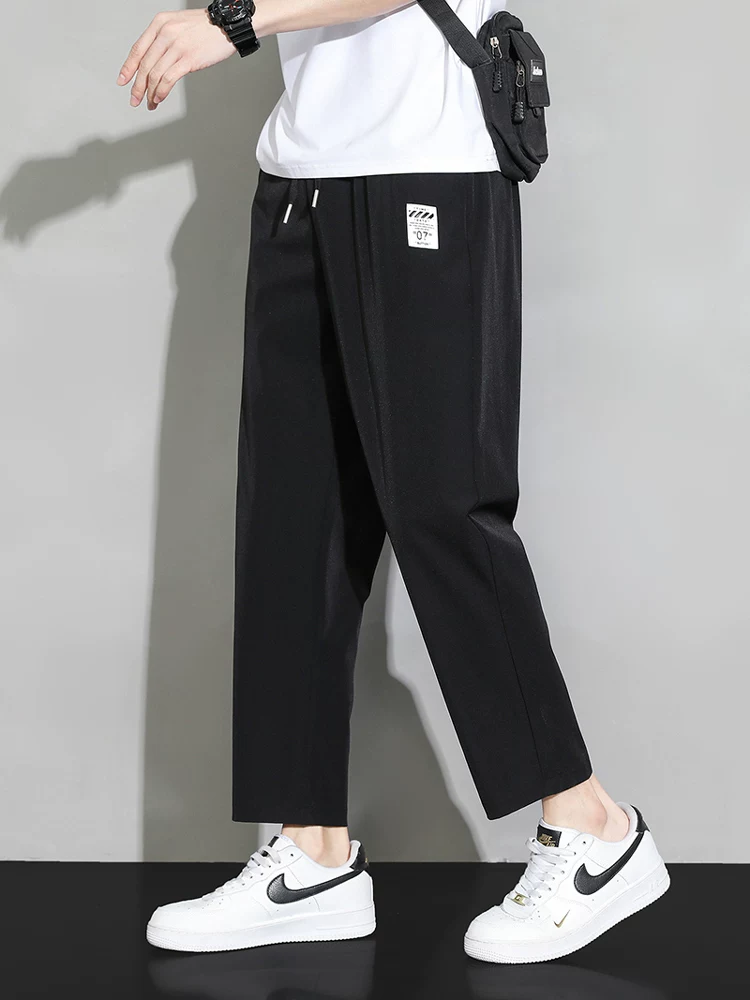 Quần dài mùa hè mỏng chất liệu lụa đá chín phần của Jeanswest dành cho nam, kiểu dáng đa năng, rộng rãi, thẳng, nhanh khô, thoáng khí, quần thể thao.