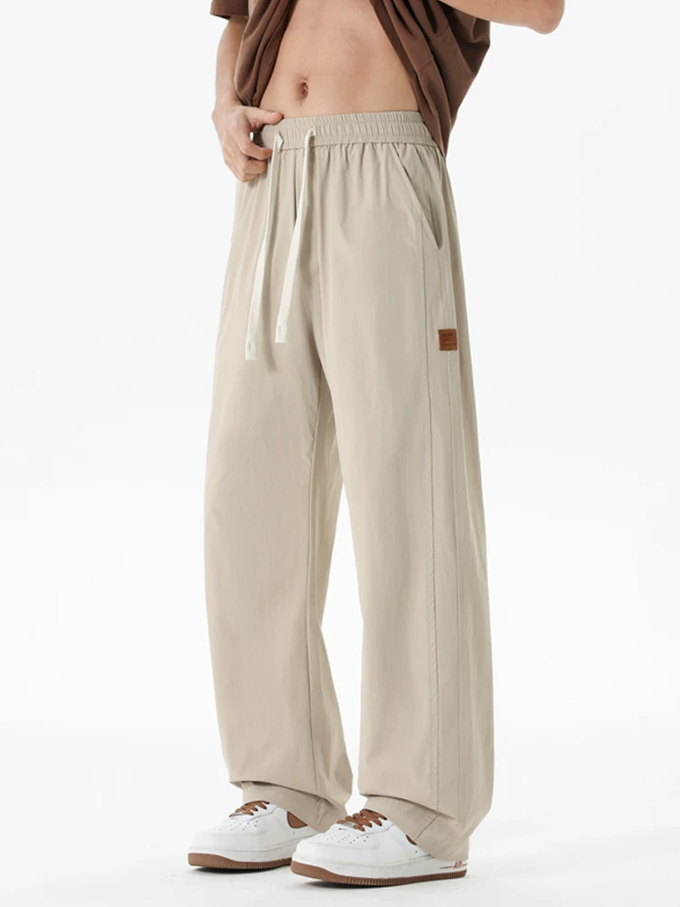 Quần dài Jeanswest dáng rộng, chất liệu lụa băng mỏng, phong cách thường ngày dành cho nam, quần dài thương hiệu thời trang cao cấp mùa hè.