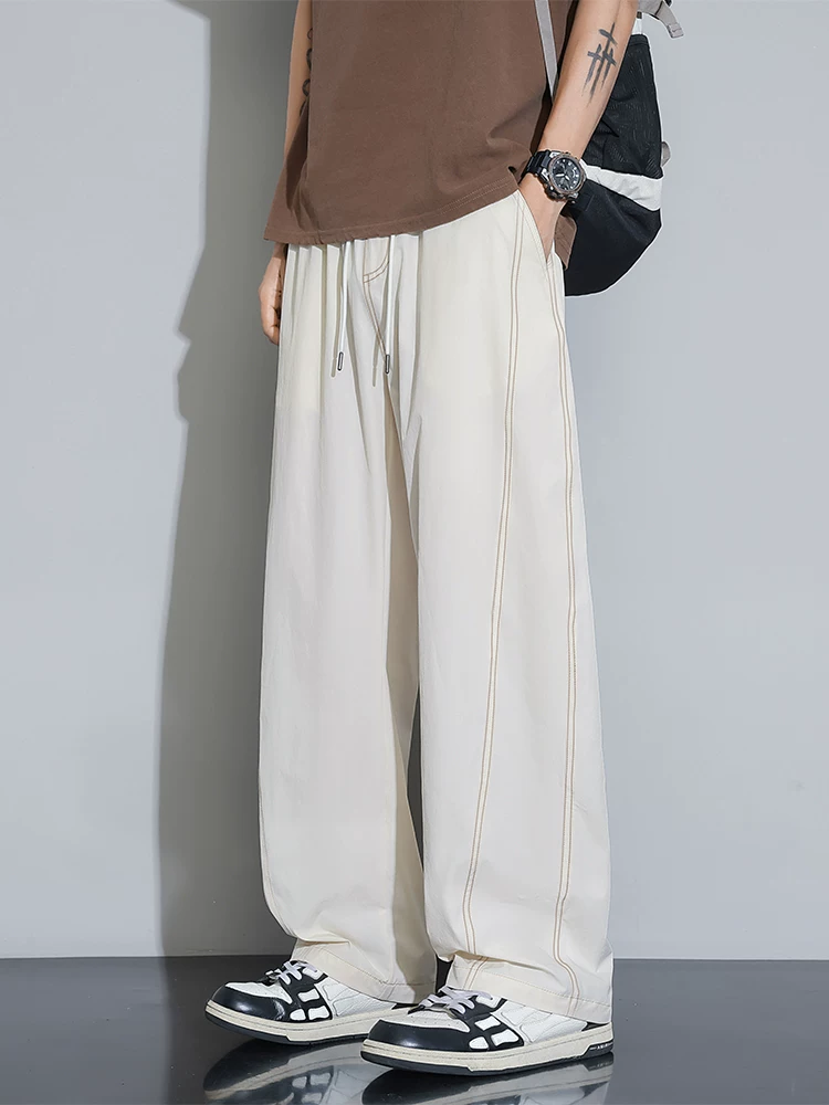 Quần âu nam Jeanswest phong cách Mỹ, mẫu mới hè 2026, dáng rộng, đa năng, quần thể thao ống đứng suông mềm mại.