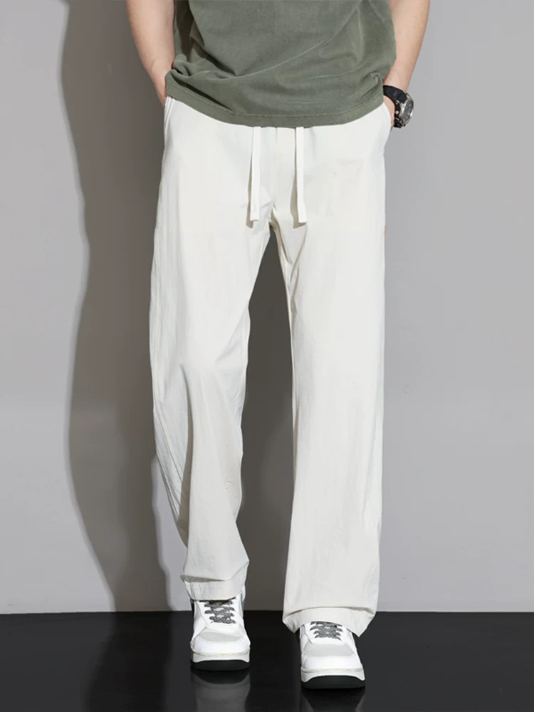 Quần dài dáng rộng cao cấp của Jeanswest dành cho nam, mùa xuân thu phong cách Mỹ, thương hiệu thời thượng, quần dài dáng suông đa năng, phong cách thời trang.