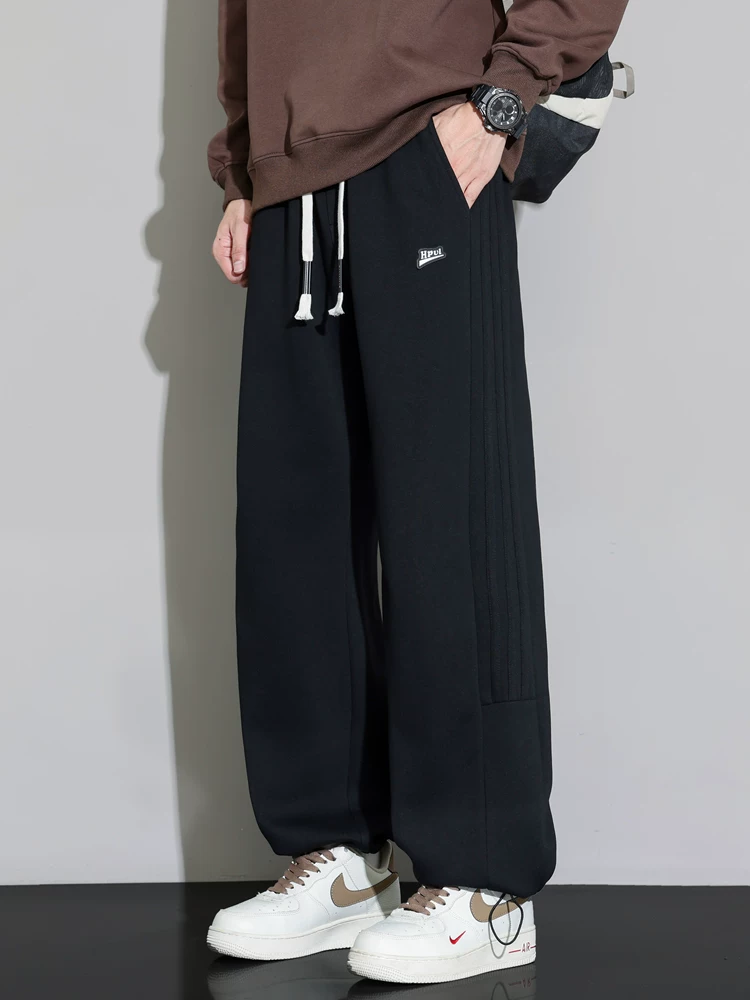 Quần jogger nam Jeanswest 2026 mới, dáng rộng, màu xám, chất liệu mềm mại, đa năng, phong cách thể thao, dài.