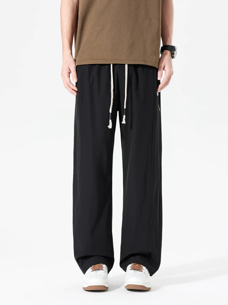 Quần dài thể thao ống đứng phong cách Mỹ thời thượng của Jeanswest dành cho nam, mùa xuân hè, cảm giác cao cấp, dáng rộng, đa năng, thoáng khí.