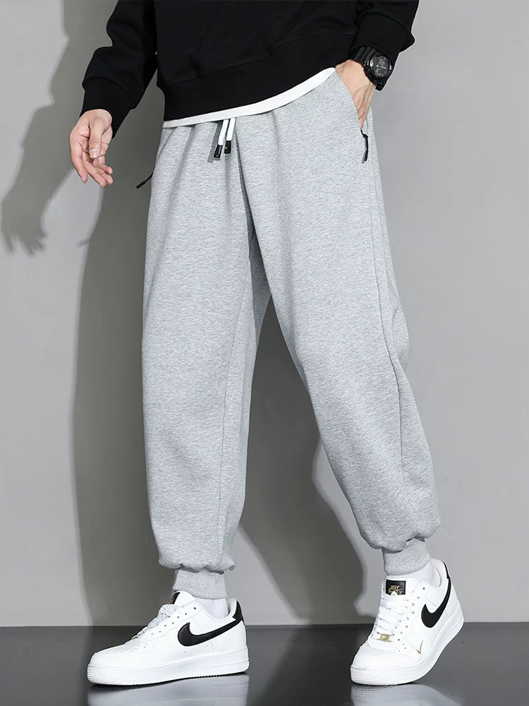 Quần cotton nguyên chất Jeanswest dành cho nam, quần thể thao dáng rộng, quần jogger nam xuân thu, quần dài đa năng cao cấp.