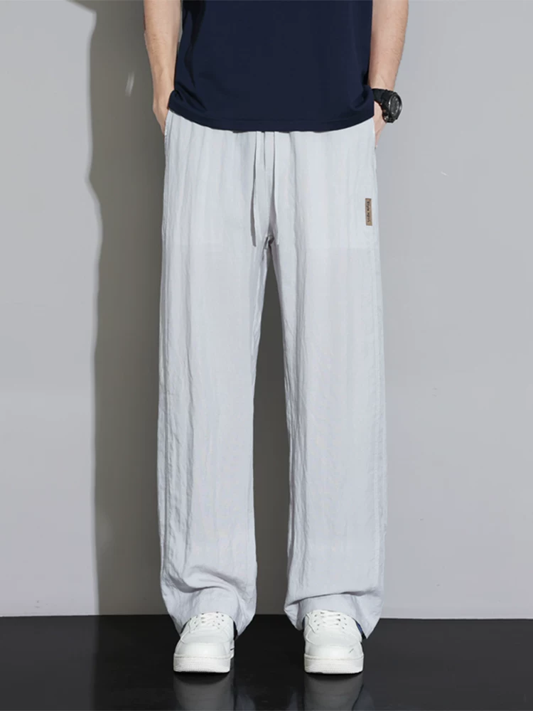 Quần dài ống đứng Lyocell cao cấp của Jeanswest dành cho nam, quần dài dáng rộng đa năng phong cách Mỹ mùa xuân thu.