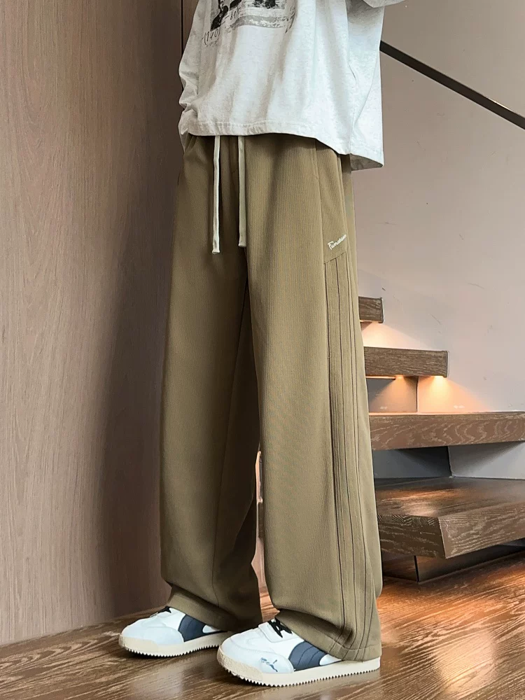 Quần dài ống đứng màu đen phong cách Mỹ của Jeanswest dành cho nam, mẫu mới mùa xuân 2026, quần dài cao cấp, quần thể thao.