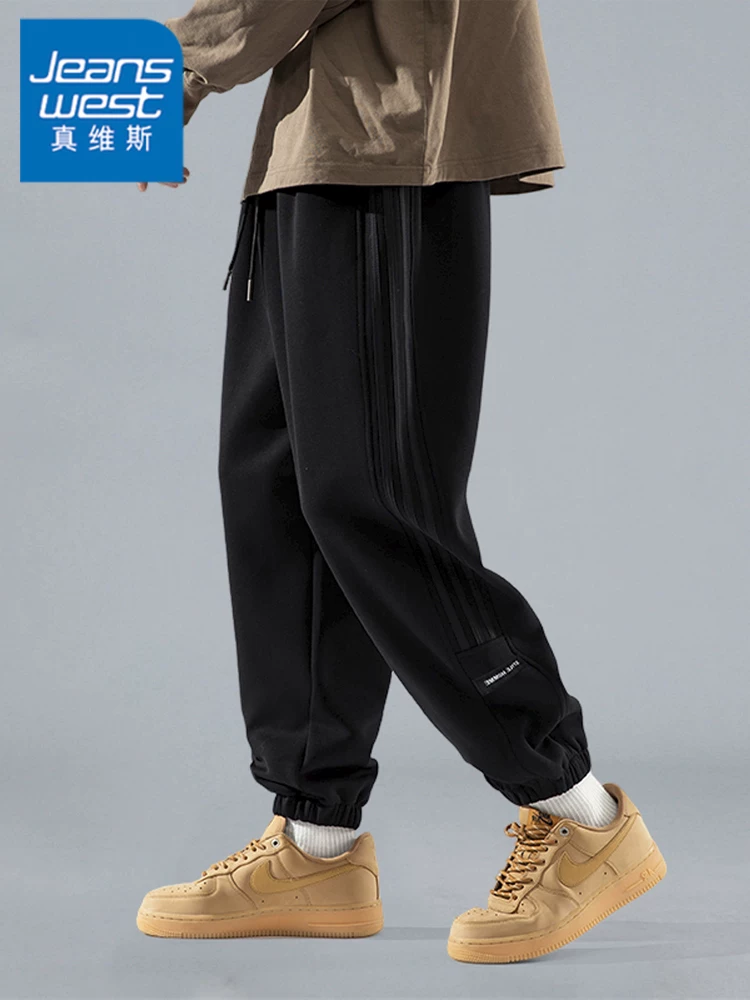 Quần jogger thể thao màu đen phong cách Mỹ của Jeanswest dành cho nam, quần dài dáng rộng thoải mái mới mùa xuân 2026.