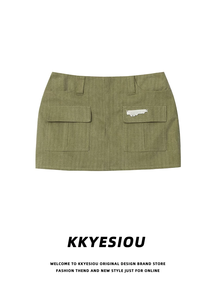 Váy ngắn màu xanh quân đội phong cách đường phố Mỹ KKyesiou, kiểu preppy, thiết kế công sở, cạp cao ôm sát hông.