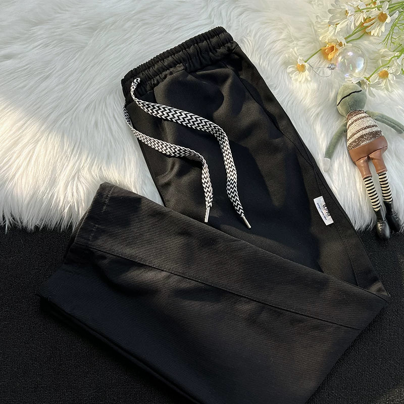 Quần công sở màu trơn cơ bản mùa xuân thu thương hiệu thời trang phong cách Nhật Bản quần nam giản dị đa năng quần dài ống rộng