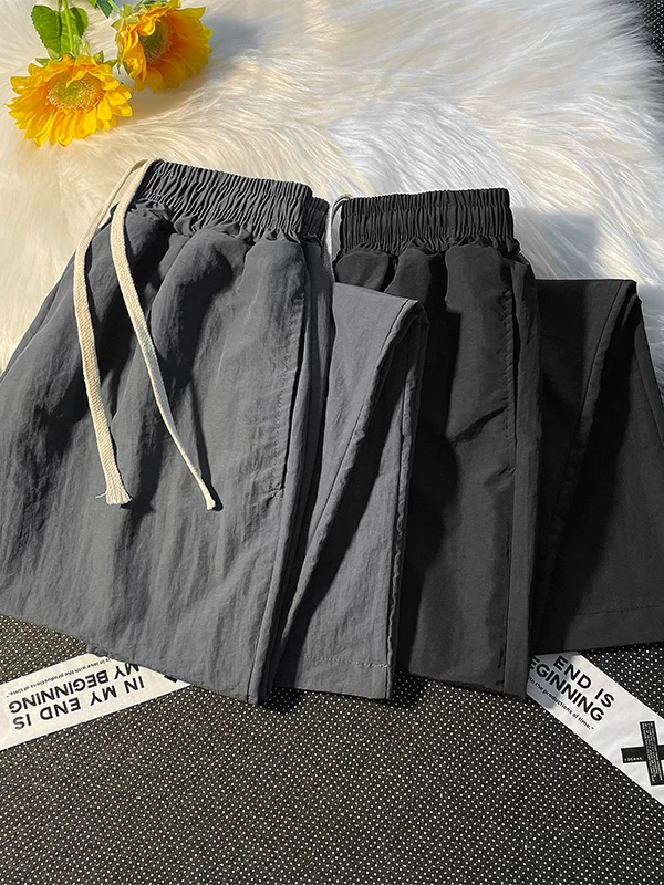 Quần dài mùa hè mỏng, nhanh khô, kiểu dáng thường ngày dành cho nam, dáng rộng, hơi loe, phong cách thời thượng, quần dù thể thao đường phố.