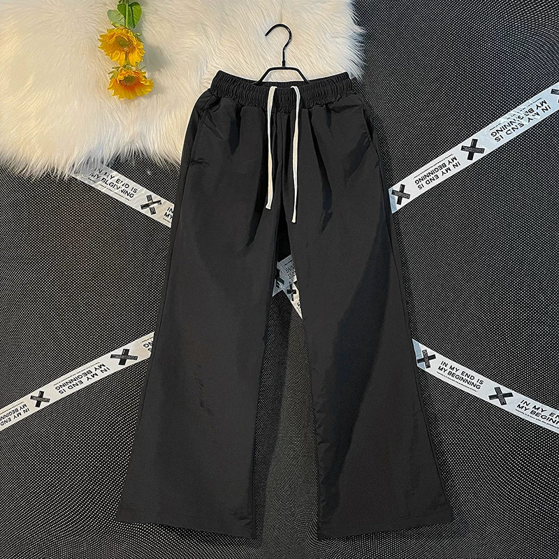 Quần nam nhẹ, nhanh khô, kiểu dáng thường ngày, quần ống loe rộng rãi mùa hè, phong cách Mỹ thời thượng, quần dù thể thao.