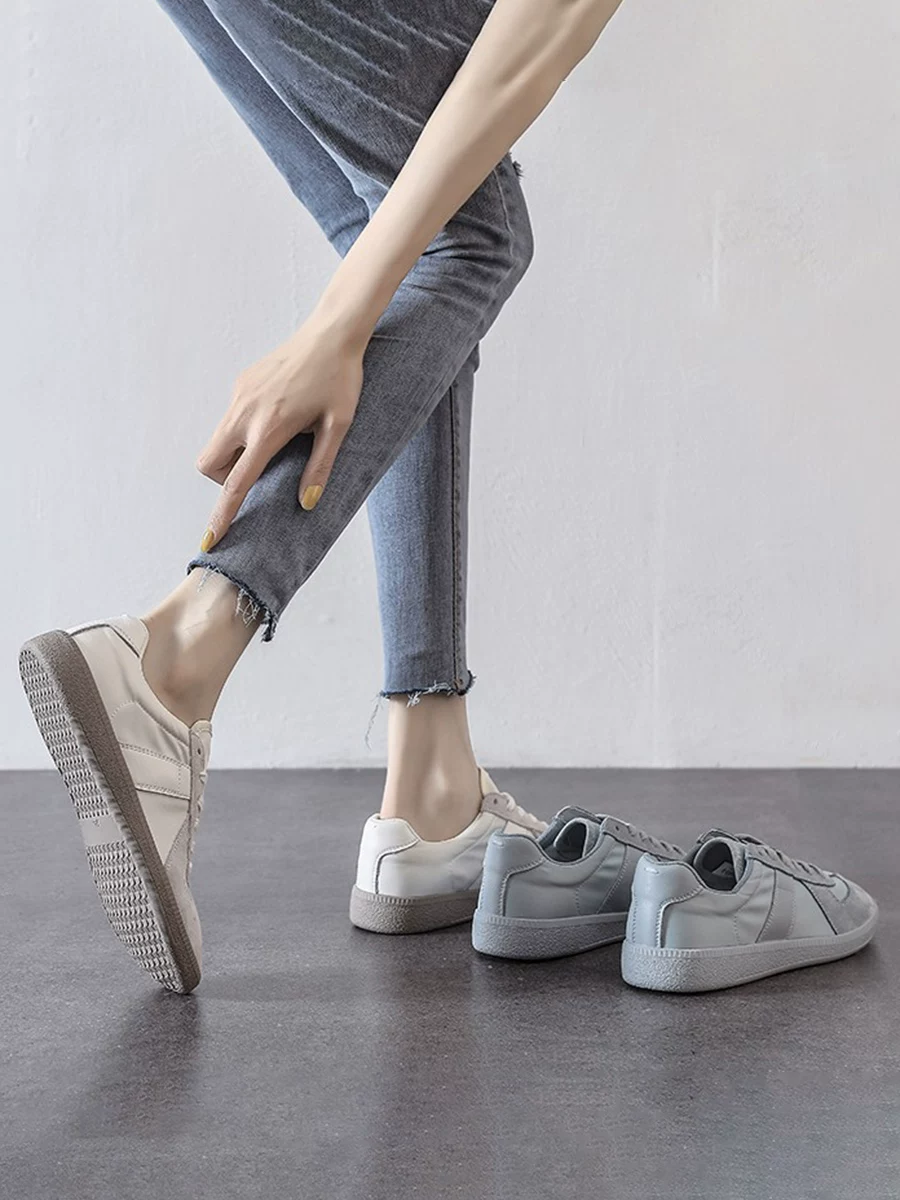 Giày thể thao nữ mùa xuân hè chất liệu lưới tơ tằm mỏng thoáng khí màu trắng, mẫu mới 2026, da thật, kiểu retro, đế mềm, giày tập luyện Đức, phong cách thường ngày.