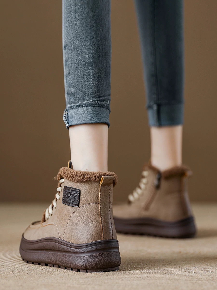 Giày bốt đi tuyết da thật cho nữ, đế dày, lót lông cừu, giày cotton cổ cao, kiểu mới mùa đông 2025, bốt Martin, bốt ngắn ấm áp phong cách thường ngày.