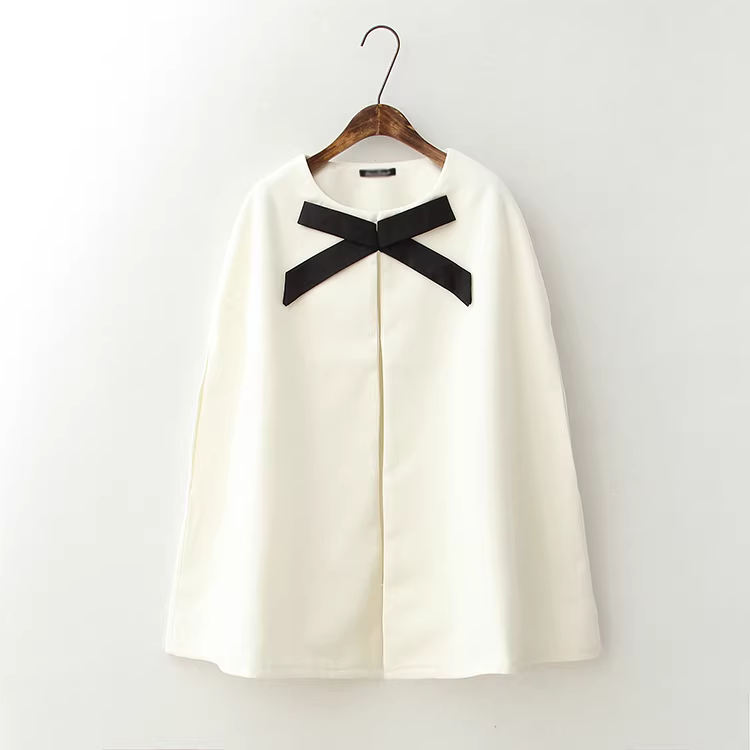 Áo khoác len dáng cape dài trung bình, kiểu dáng mới Xuân 2024 của Dream Box, thiết kế lấy cảm hứng từ Chanel, có phối nơ.