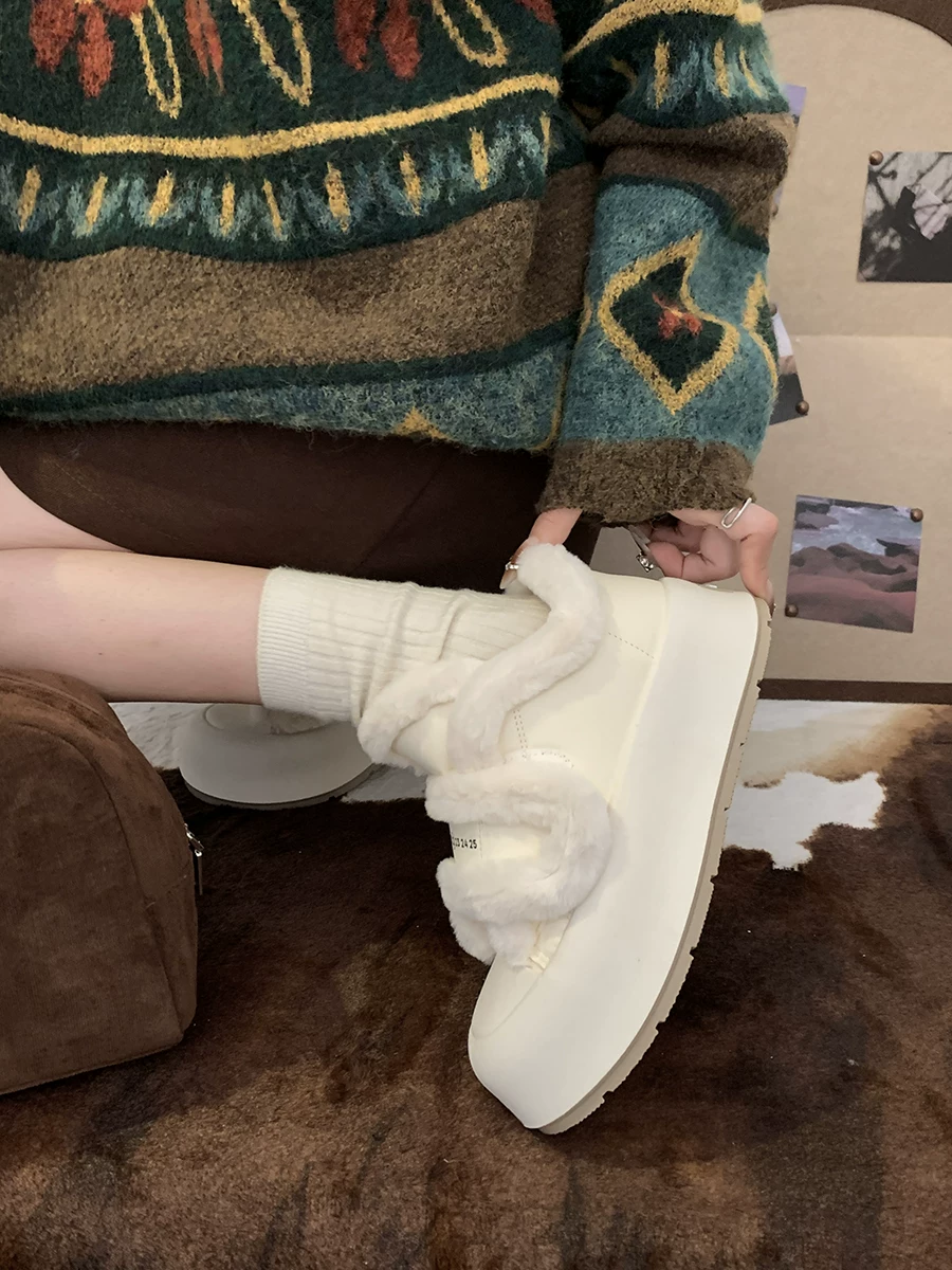 Giày thể thao đế dày mũi tròn đa năng màu trắng dành cho nữ 2025 mới thu đông Giày cotton dày lót lông cừu có khóa dán bán chạy