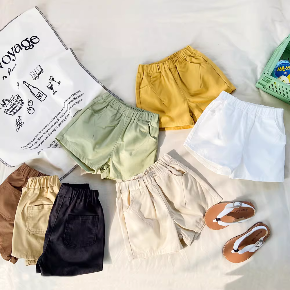 Quần đùi cotton trẻ em mùa hè 25 mẫu mới quần cargo năng động đa năng bé trai bé gái chất liệu mỏng màu trơn dài đến đầu gối