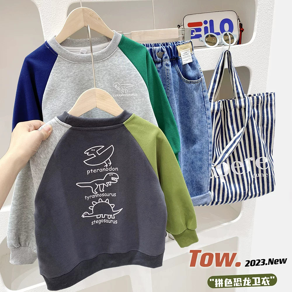 Áo thun bé trai 2025 mẫu xuân mới áo dài tay in hình khủng long áo thun bé trai size trung và lớn áo thun cổ tròn