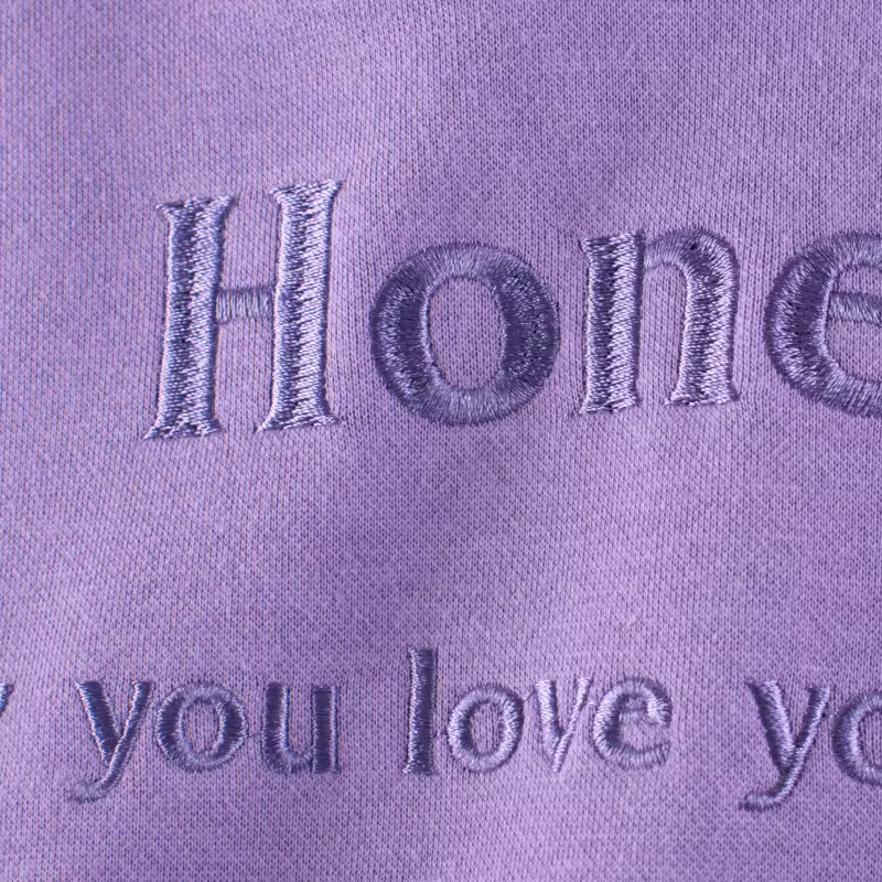 Áo nỉ trẻ em mùa xuân đông 2025 kiểu Hàn Quốc mới, áo hoodie có mũ thêu chữ ấm áp cho bé gái