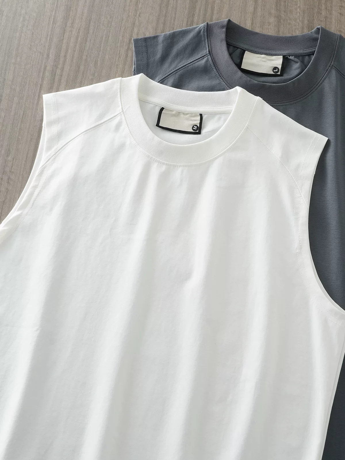 Áo vest không tay hạng nặng kiểu Mỹ dành cho nam, áo thun cổ tròn dáng rộng màu trơn mùa hè, áo lót dùng để chạy bộ, thể thao và thể hình.