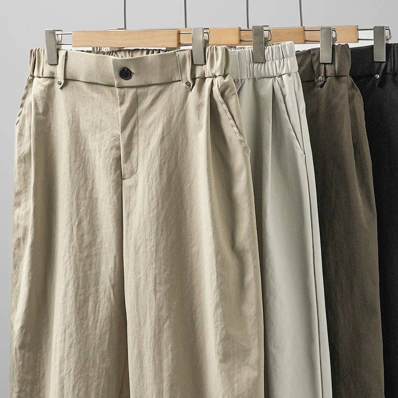 Quần âu nam dáng thẳng phong cách Mỹ OMZM, mẫu mới xuân 2025, quần ống đứng rộng, dáng suông, màu kaki, kiểu retro, quần dài