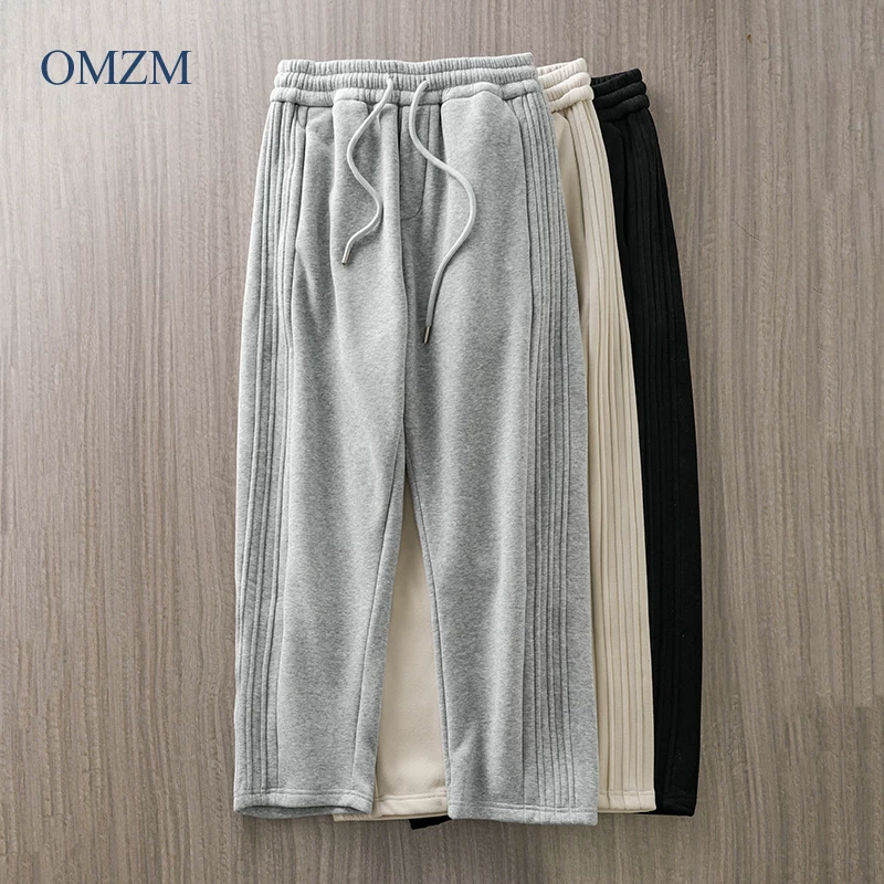 Quần thể thao lót lông cừu hạng nặng OMZM500G dành cho nam, quần ống đứng dáng rộng mùa đông, quần dài thể thao thường ngày dày dặn, kiểu dáng chắp vá.