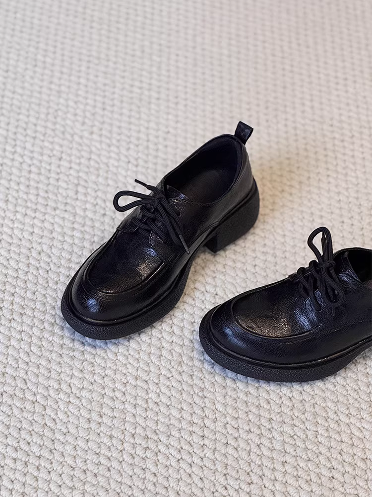 Phiên bản da cừu ~ Giày lười đi làm đế bằng da thật màu đen dành cho nữ, giày lười kiểu cổ điển buộc dây kiểu đại học cắt sâu.