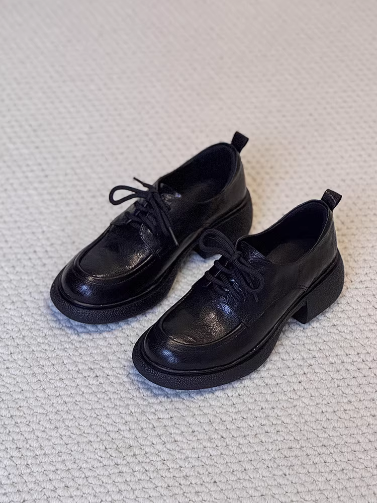 Phiên bản da cừu ~ Giày lười đi làm đế bằng da thật màu đen dành cho nữ, giày lười kiểu cổ điển buộc dây kiểu đại học cắt sâu.