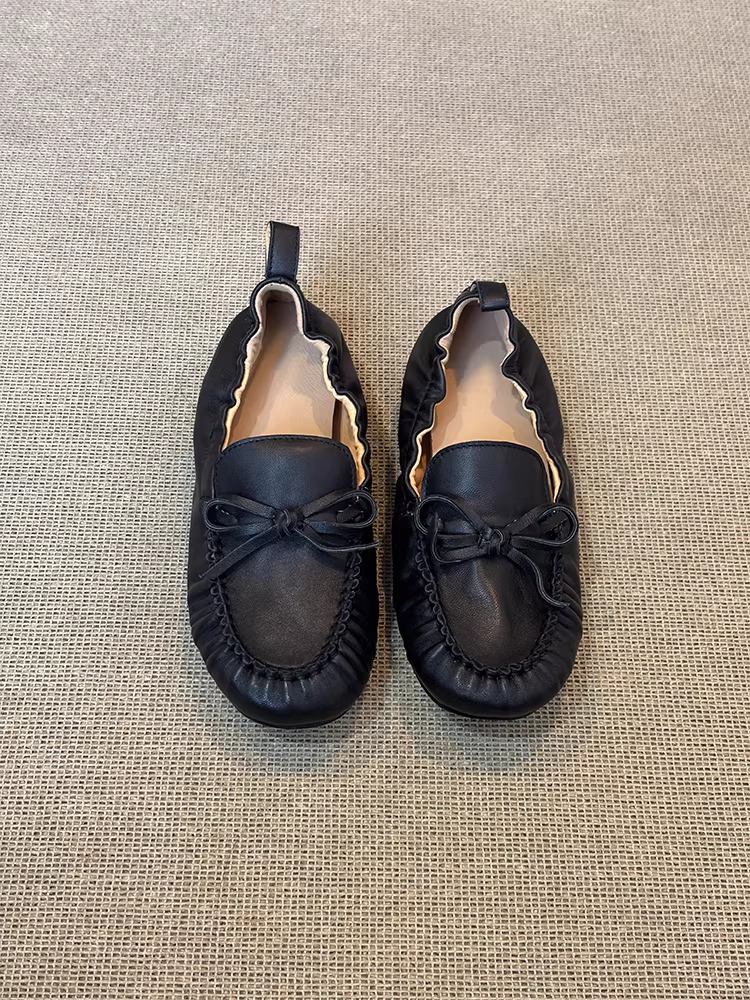 Phiên bản da cừu ~ Giày lười da thật có nơ màu đen mũi tròn dành cho nữ, giày đế mềm xếp ly thoải mái, kiểu dáng dễ mang