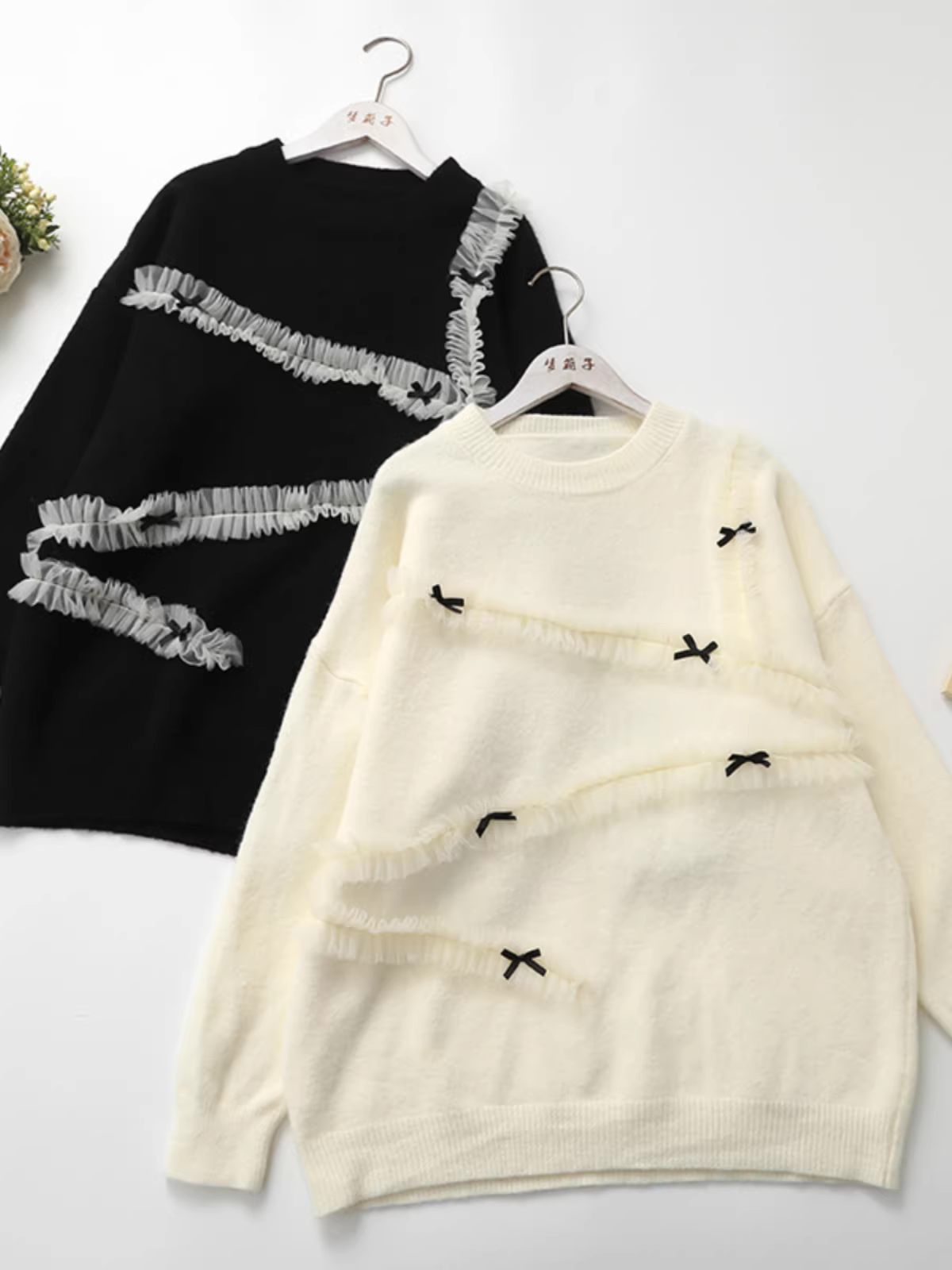 Áo len dáng rộng tay dài cổ tròn phối bèo nhún nơ xinh mùa đông Dream Box 2024