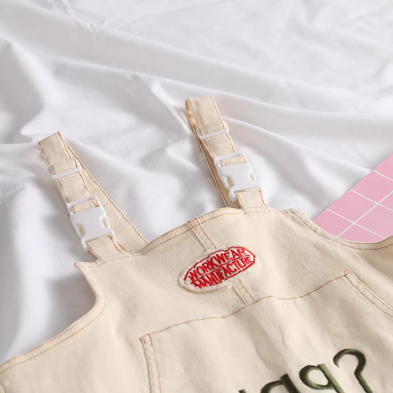 Quần yếm nữ cotton co giãn đa năng, màu trơn, kiểu dáng thẳng, thêu chữ mới Xuân 2024, thương hiệu Dream Box