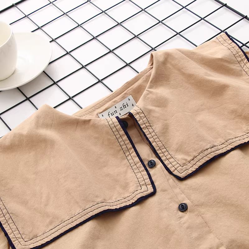 Áo sơ mi cotton cổ trụ màu xanh navy phối viền đen kiểu dáng mới Xuân 2024 của Dream Box dành cho nữ, kiểu dáng dài tay, rộng rãi, phong cách quý tộc.