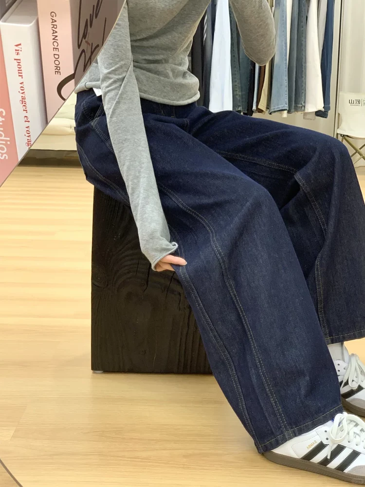 Quần jean nữ màu xanh đậm, dáng thẳng ôm dáng, kiểu mới thu đông 2025, size lớn, cạp cao, che hông, quần ống rộng tôn dáng.