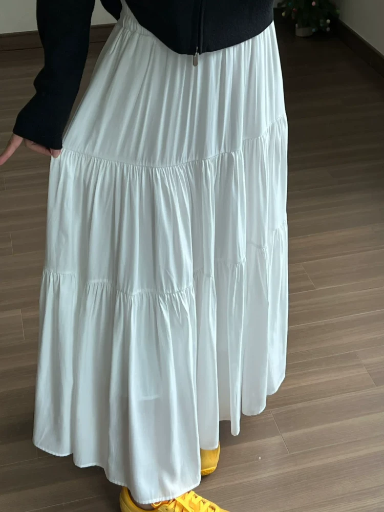 Váy trắng nửa thân cho nữ, hè 2025, size lớn, cạp cao, dáng chữ A xếp tầng, dài ngang đùi, kiểu xòe bồng bềnh.