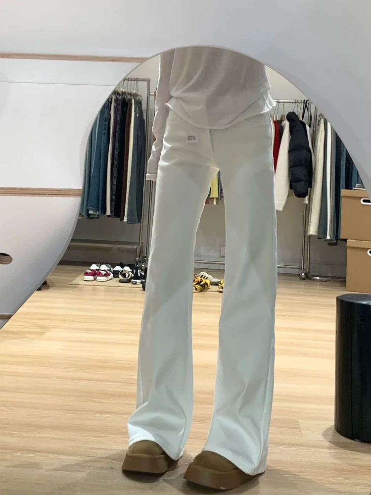 Quần jean loe nữ không bó sát chân, kiểu mới thu đông 2025, size lớn, cạp cao, co giãn, tôn dáng, quần ống chuông màu trắng