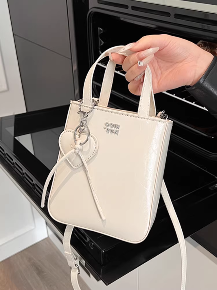 Túi đựng điện thoại di động dành cho nữ, đeo chéo, kiểu mới 2025, đơn giản và đa năng, túi xách thiết kế độc đáo, túi nhỏ phong cách Hàn Quốc để đựng điện thoại.