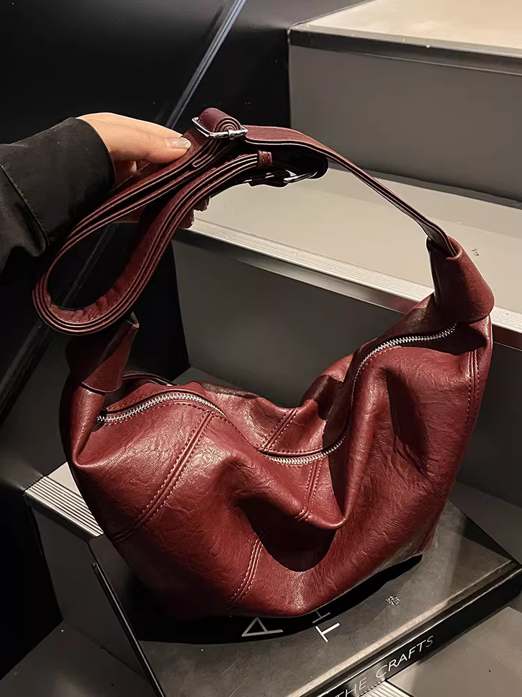 Túi xách nữ cao cấp, chất liệu có vân, dung tích lớn, mẫu mới thu đông 2025, túi đeo chéo/vách vai độc đáo, chất liệu da mềm, kiểu dáng túi bánh bao tiện dụng.