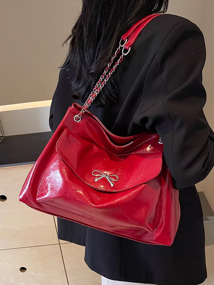 Túi xách nữ dung tích lớn 2025 kiểu dáng mới màu đen dây xích cao cấp túi đeo vai đi làm túi tote có họa tiết