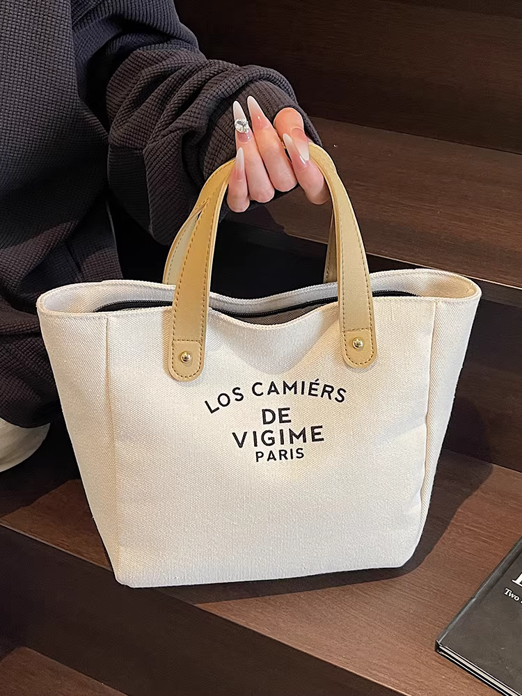 Túi vải canvas nữ, dung tích lớn, kiểu dáng mới 2025, đa năng, túi xách đơn giản, túi tote giản dị dành cho sinh viên đi học.