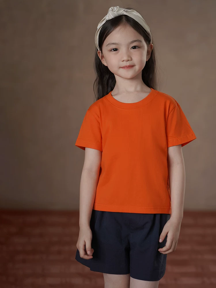 Quần áo trẻ em Hazi Áo thun trẻ em cổ tròn thông thường đa năng nhiều màu sắc tùy chọn mùa hè cho bé trai và bé gái tay ngắn 2025 Áo thun trắng mới