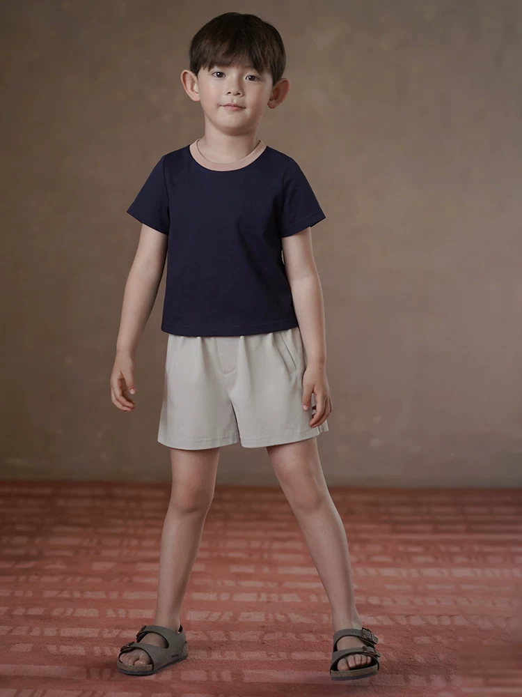 Quần đùi dệt kim trẻ em cho bé trai và bé gái, quần ống đứng màu kaki, quần thể thao dáng rộng năm điểm, mỏng.