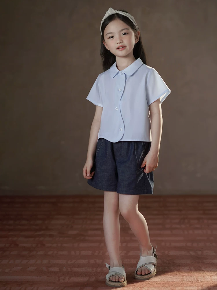 Quần áo trẻ em Hazi Quần áo mùa hè 25 kiểu mới Áo cotton thân thiện với da màu xanh Áo sơ mi ngắn tay cho bé gái Thiết kế đơn giản