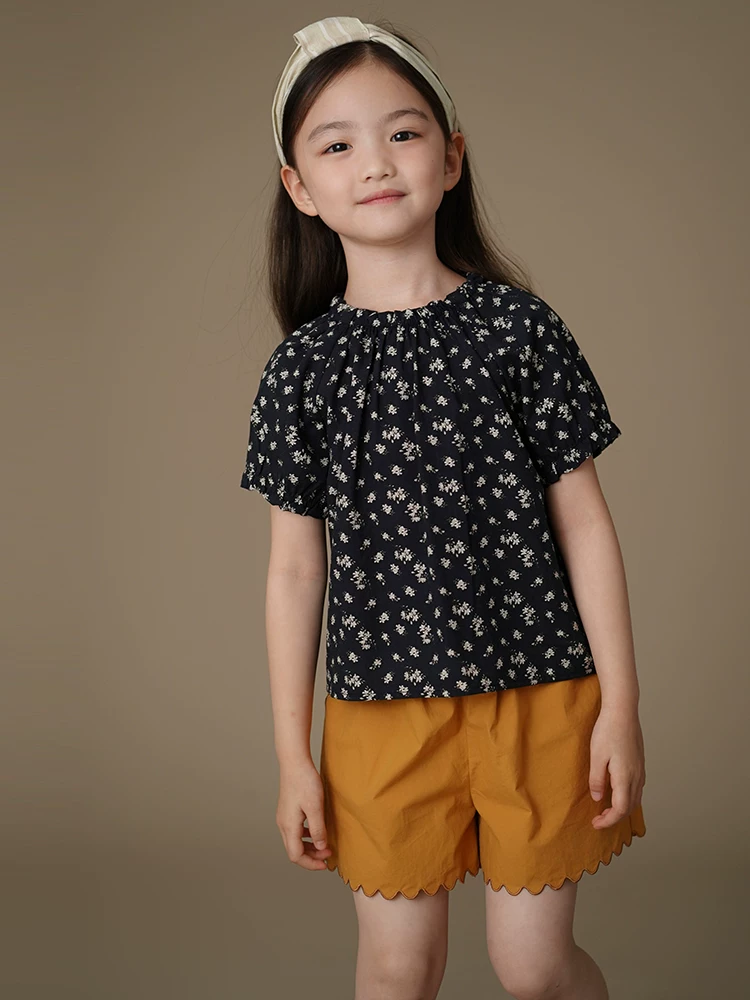 Quần áo trẻ em mùa hè mỏng năm điểm quần short trẻ em quần short giản dị bé gái quần màu vàng gừng thiết kế đơn giản cotton