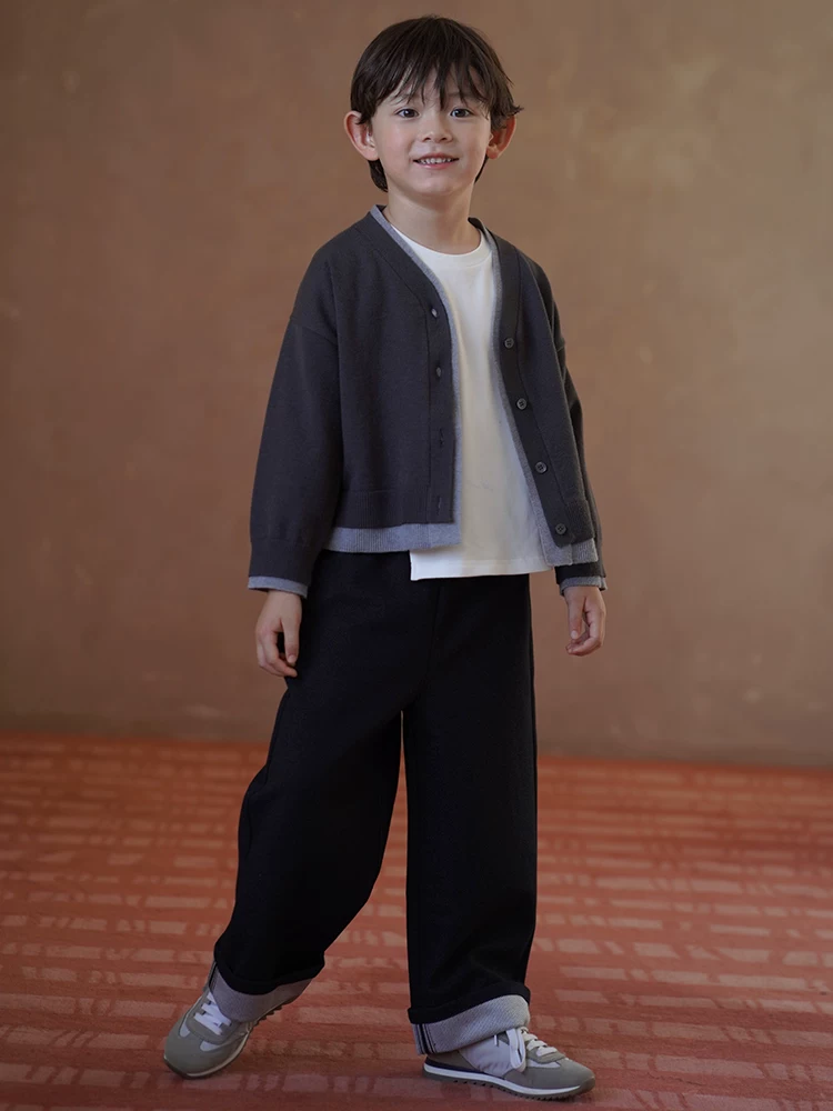 Quần dệt kim trẻ em đa năng quần rộng màu đen quần âu bé trai bé gái quần ống đứng có bo gấu mùa thu đông