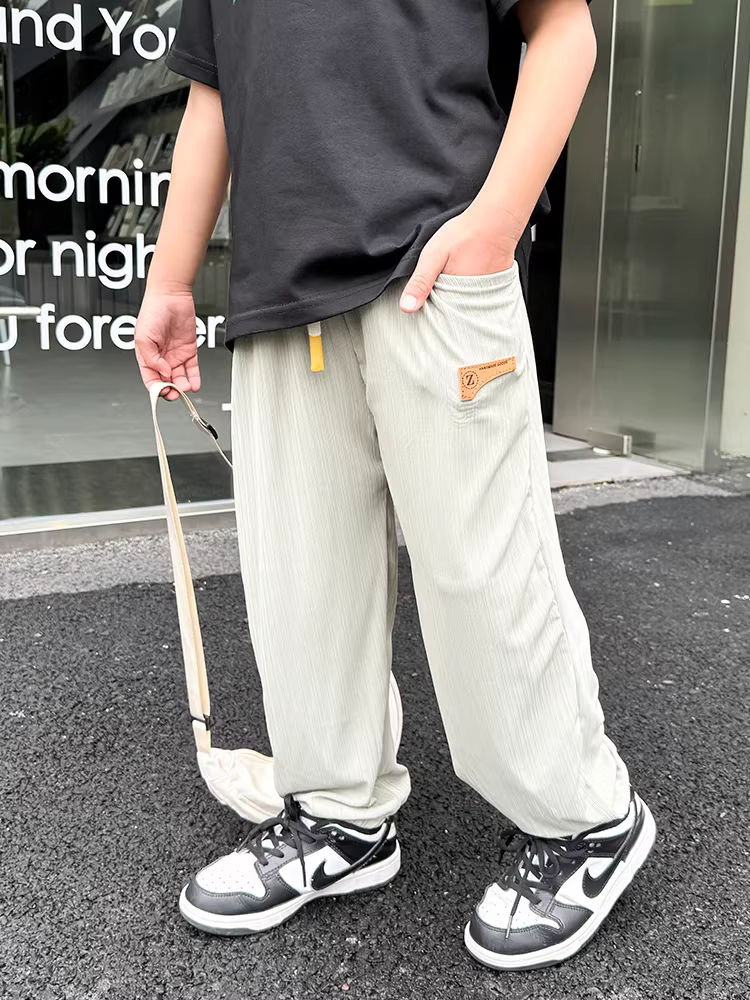 Quần trẻ em bé trai chống muỗi mùa hè 2025 kiểu mới mỏng nhẹ quần dài trẻ em thời trang cá tính trẻ trung